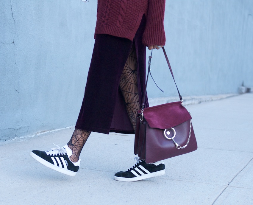 karen blanchard carrying the chloe faye bag with adidas gazelle trainers and long velvet skirt