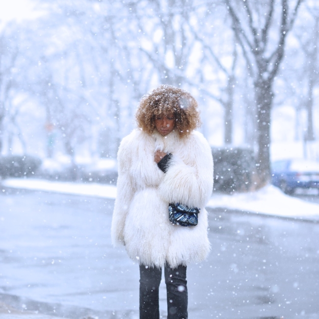 Karen Blanchard the fashion blogger wearing a mongolian fur coat and free people snake print boots