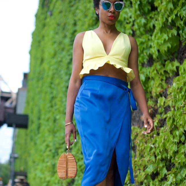 karen blanchard the fashion blogger wearing a yellow bralet top and satin skirt